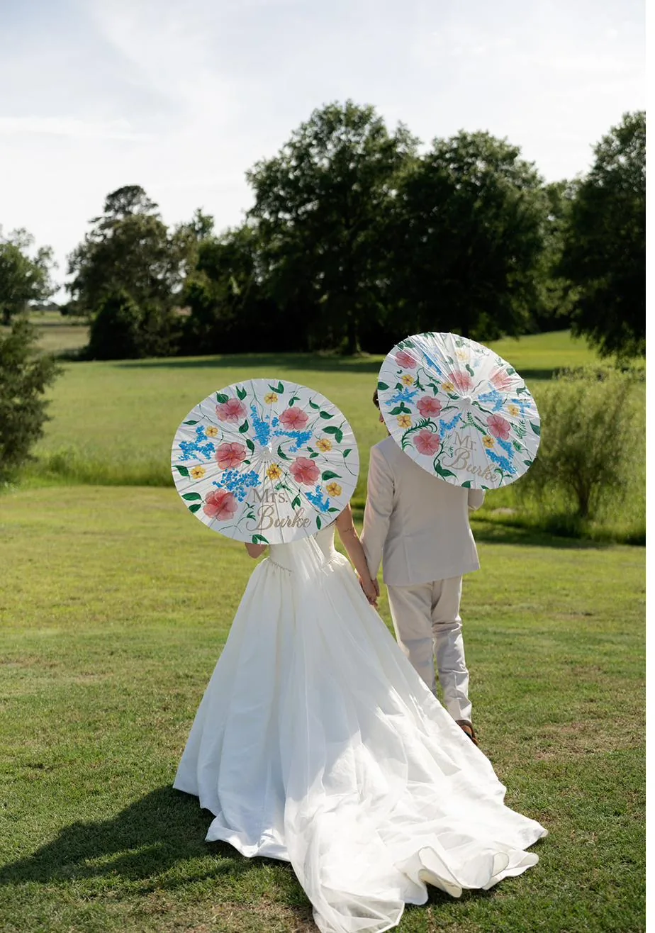 Bailey with colorful parasols for the New Orleans second line at Gateley Hill Gardens