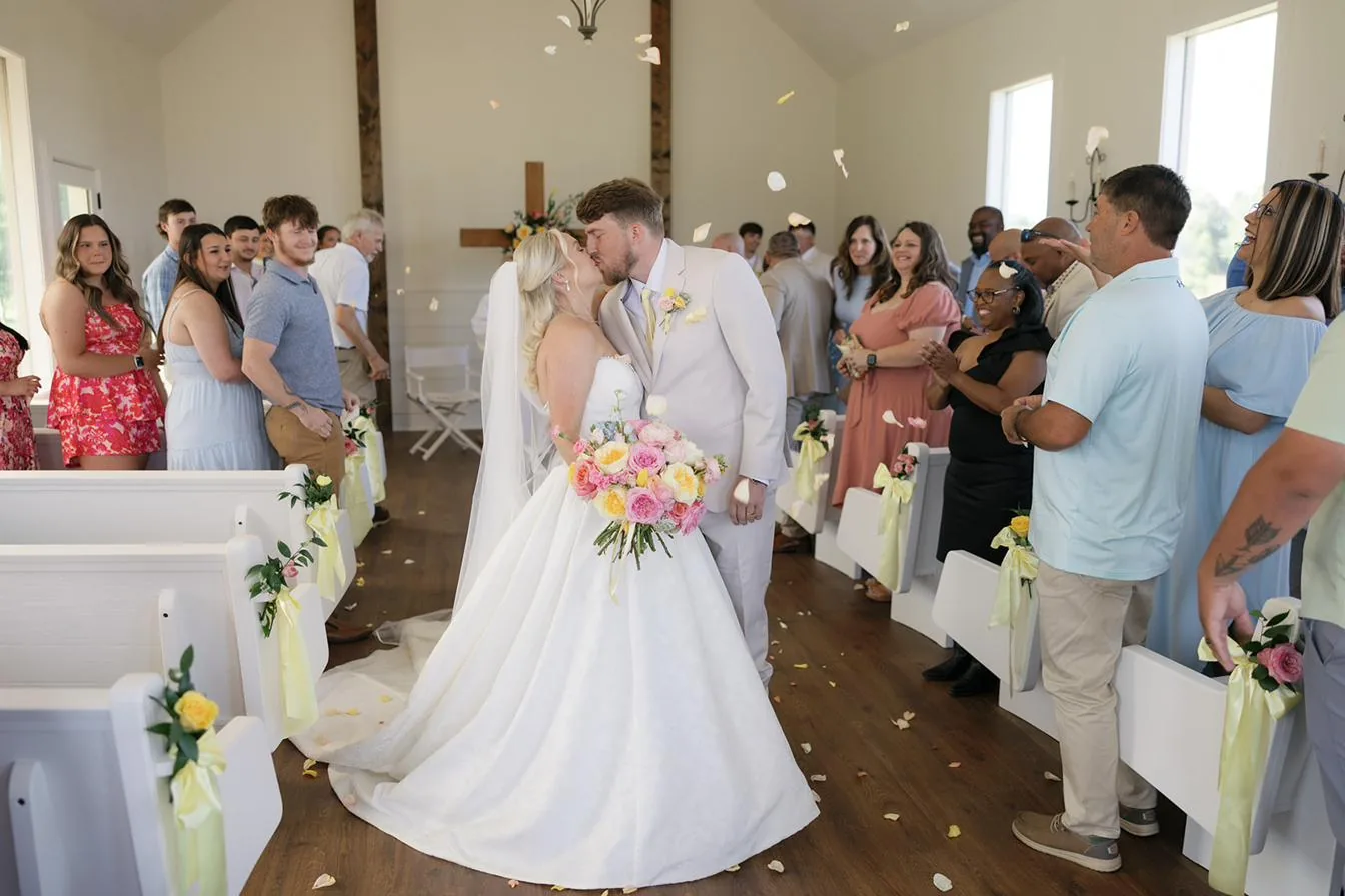 The recessional kiss down the aisle at Gateley Hill Gardens