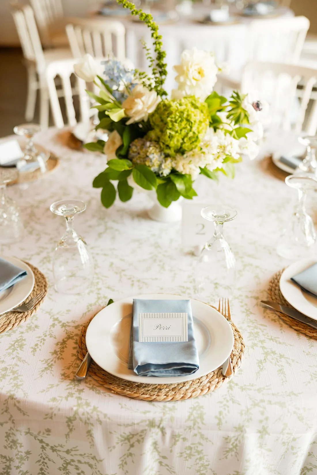 Blue and white reception tablescape with garden centerpiece at Gateley Hill Gardens