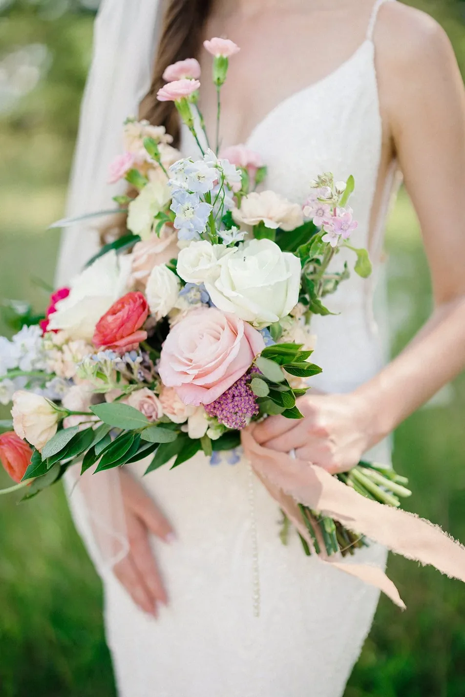 Bride with her bouquet before the ceremony at Gateley Hill Gardens