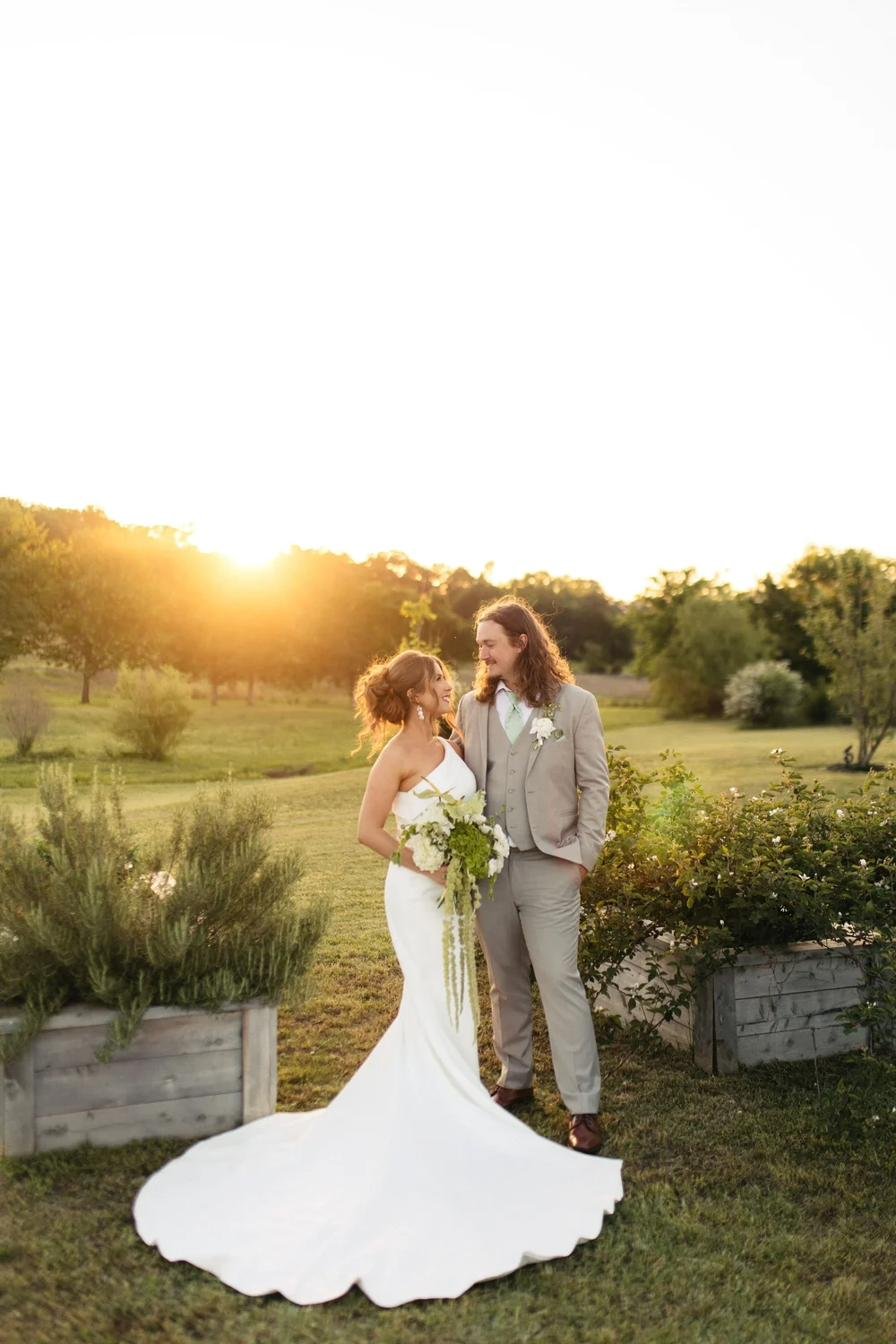 Couple at sunset in the gardens at Gateley Hill Gardens